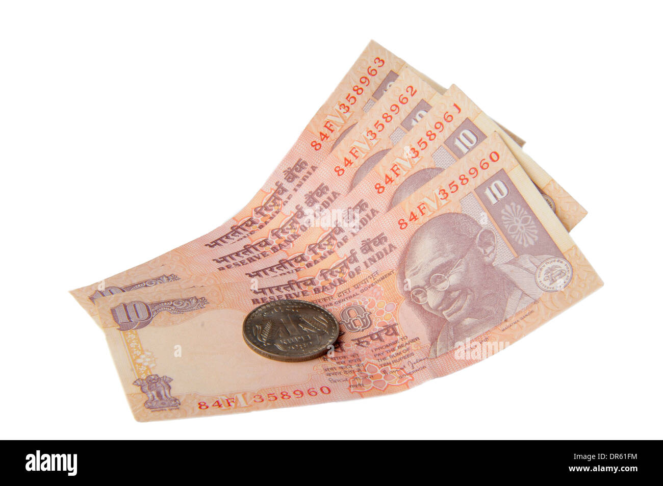 Eine zehn Rupien-Noten und eine Rupie-Münze, indische Währung Stockfoto