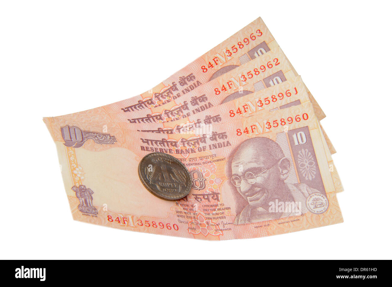 Eine zehn Rupien-Noten und eine Rupie-Münze, indische Währung Stockfoto