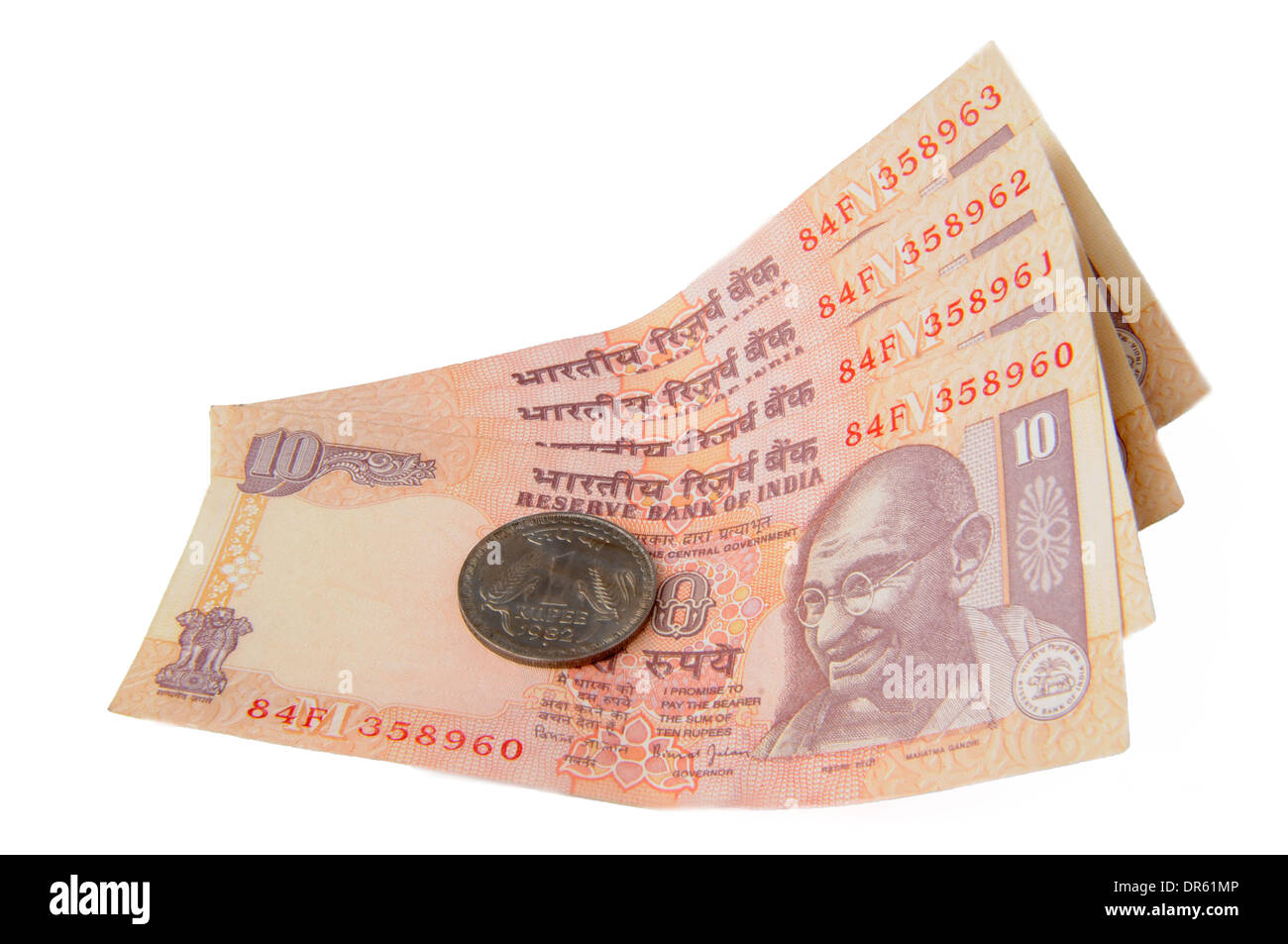 Eine zehn Rupien-Noten und eine Rupie-Münze, indische Währung Stockfoto