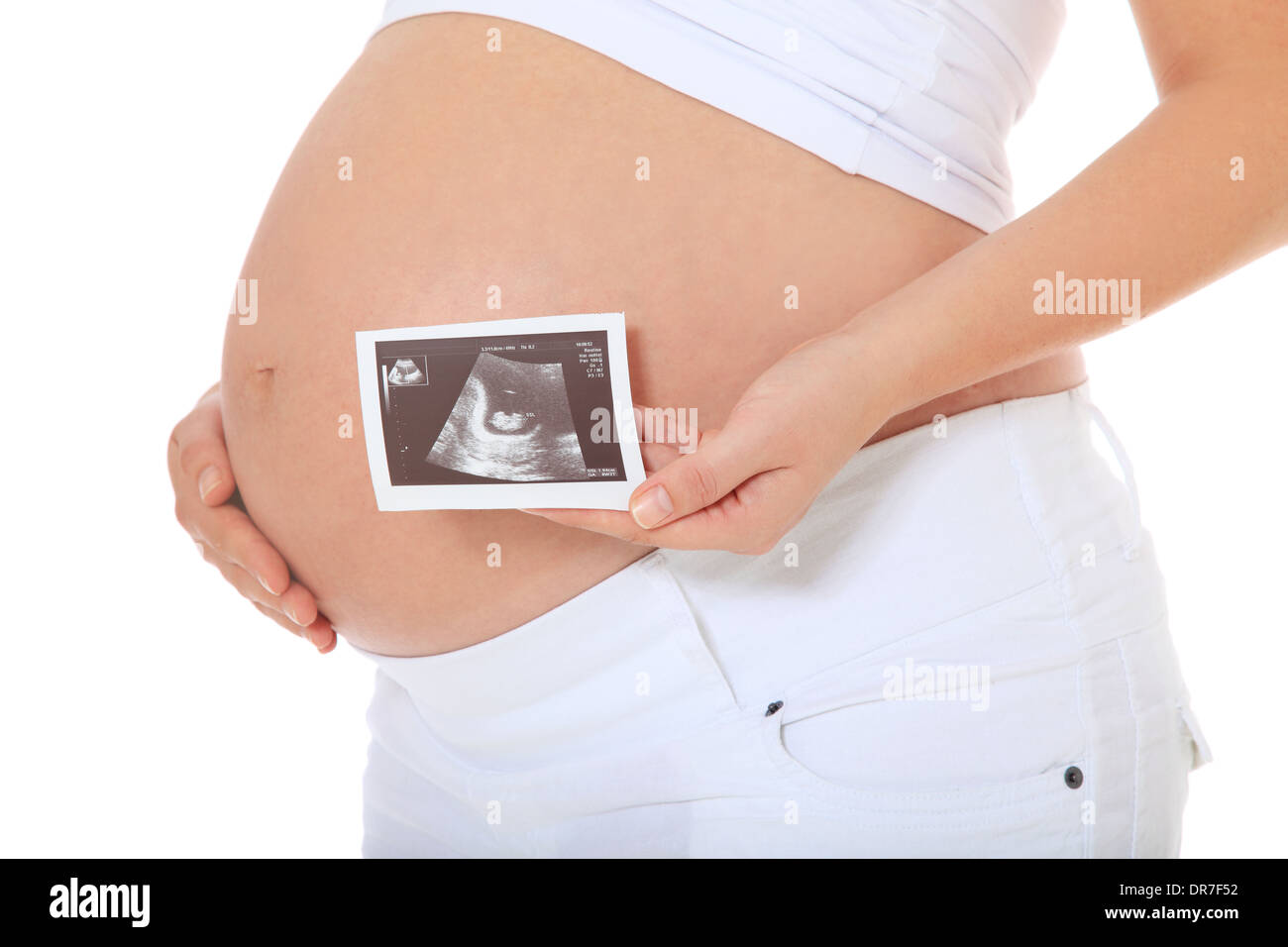 Baby-Bauch einer schwangeren Frau. Alle auf weißem Hintergrund. Stockfoto