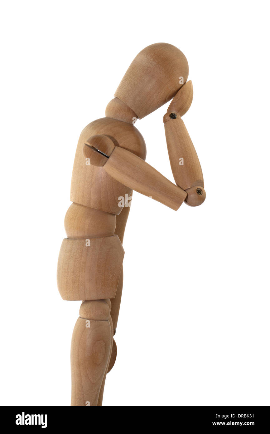 Holzfigur in einer notleidenden Haltung isoliert auf weißem Hintergrund Stockfoto