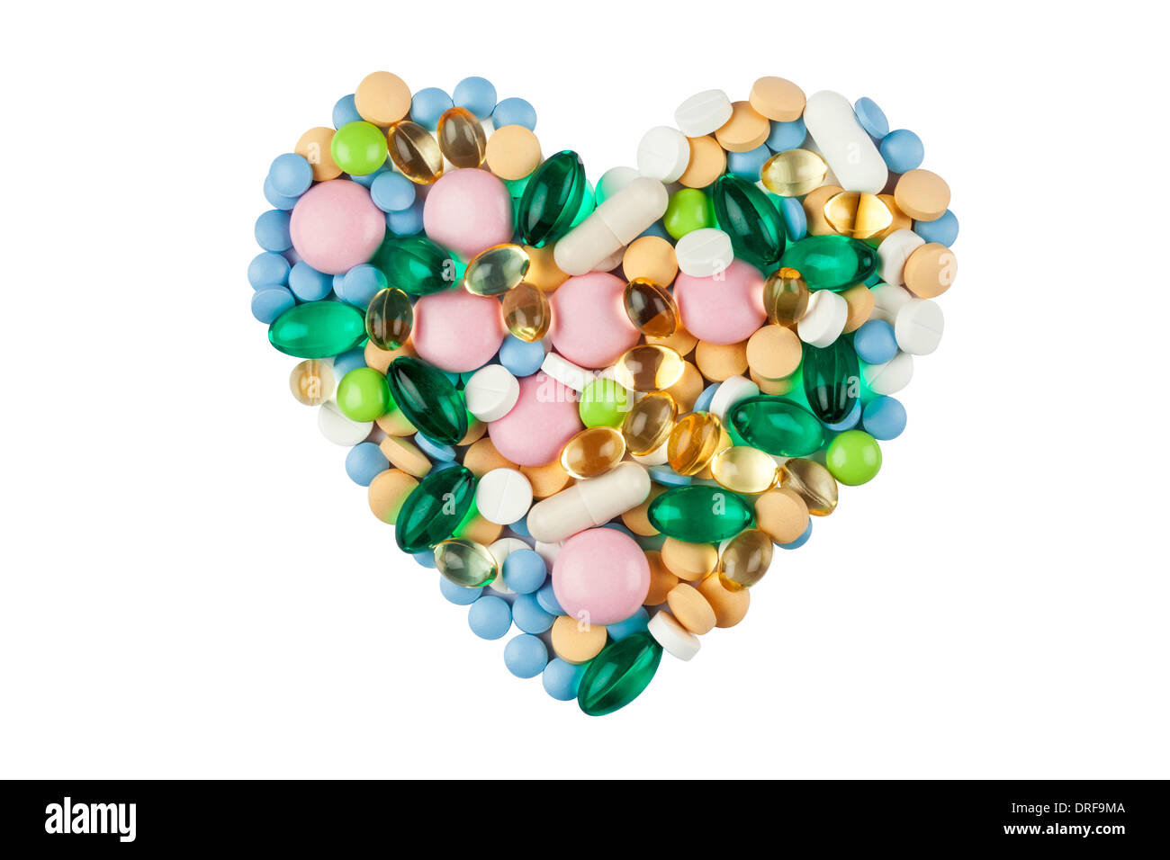 Herzform gemacht von Farbe Pillen und Kapseln, isoliert auf weiss Stockfoto