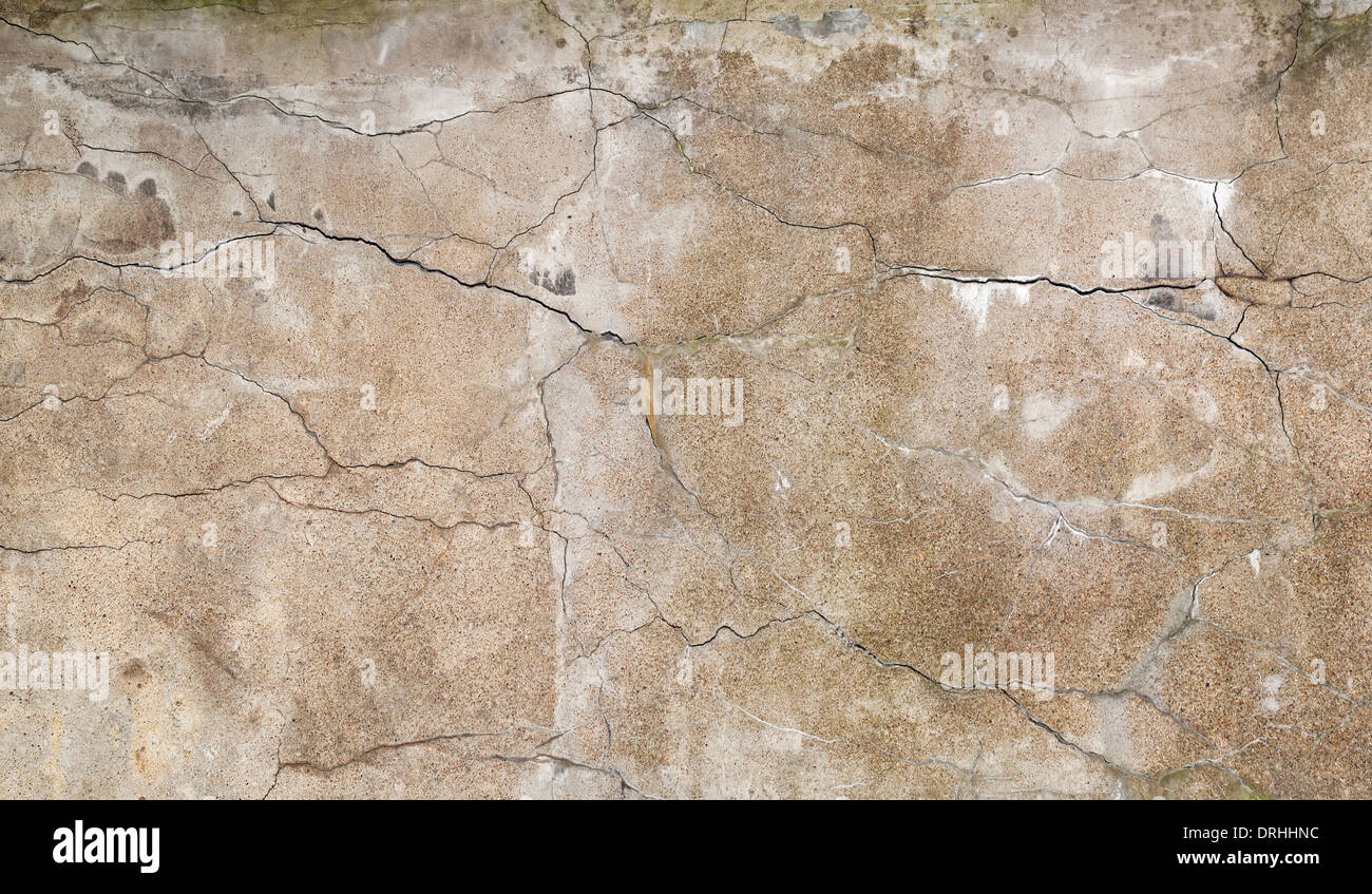 Hintergrundtextur alte gelbe Wand mit Stuck und Risse Stockfoto