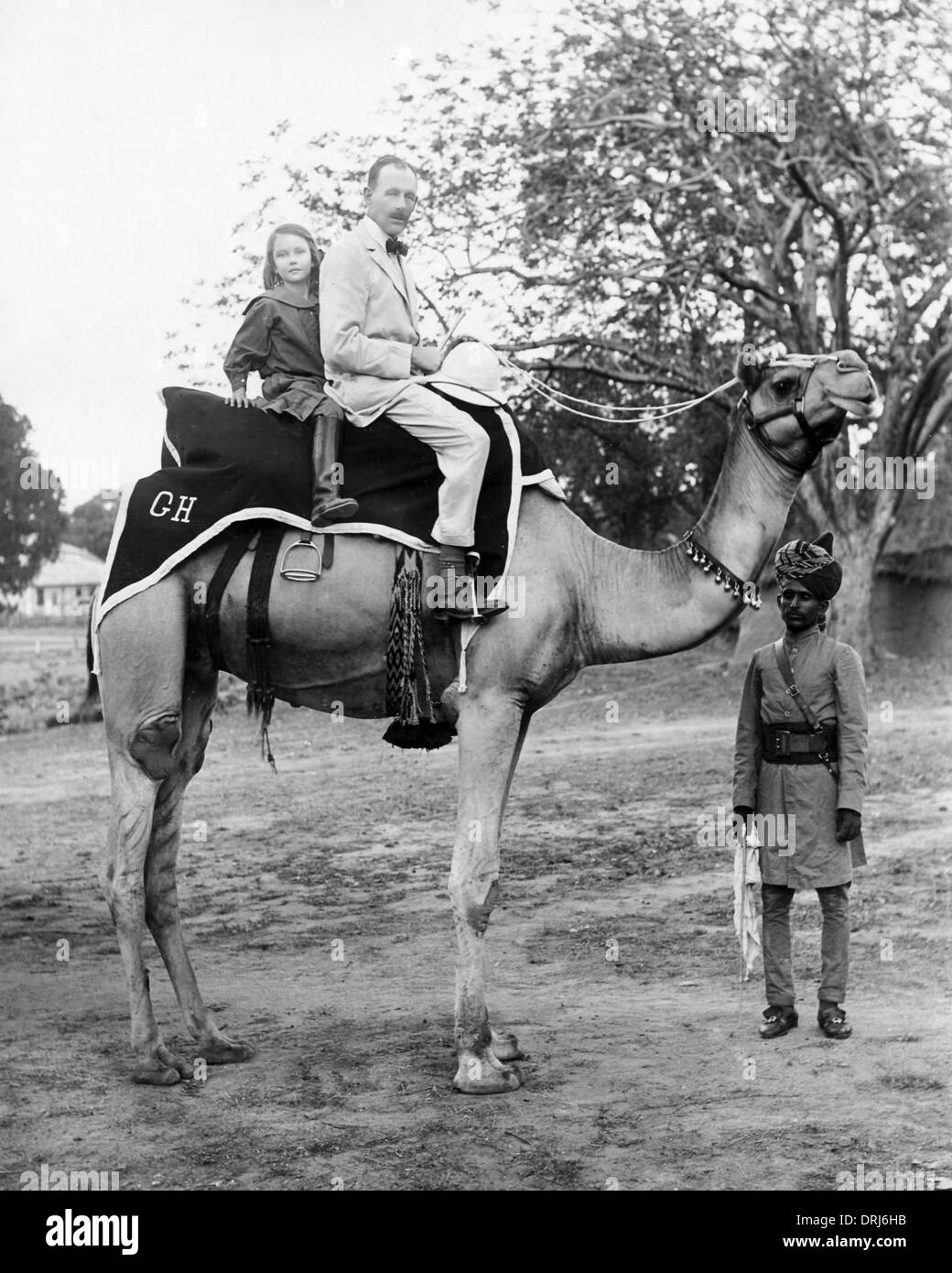 Europäischen Mann und Tochter auf Kamel, Indien Stockfoto
