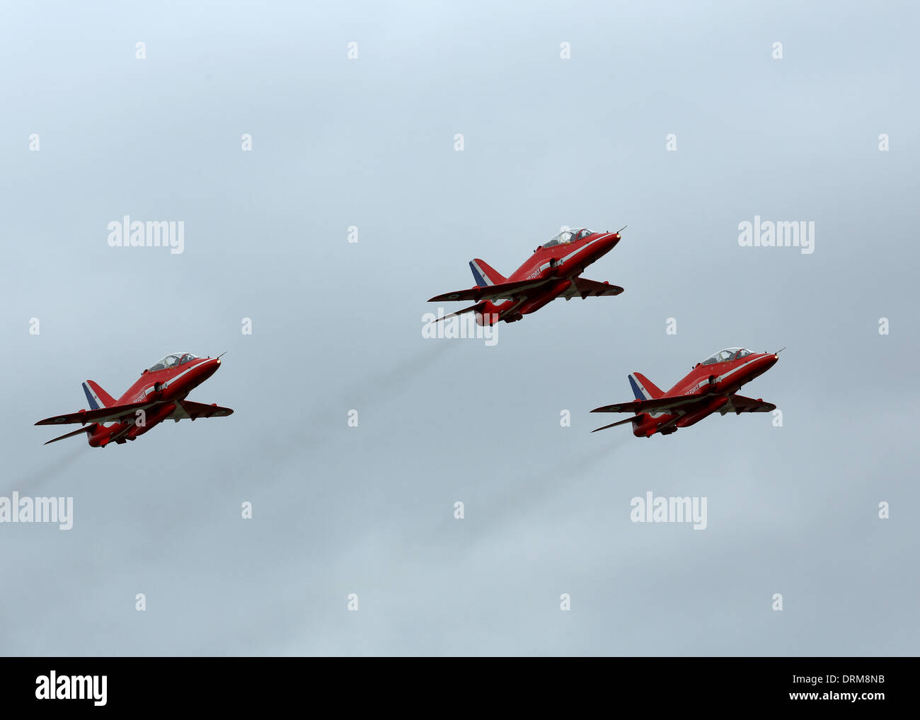 Drei der Red Arrows RAF-Ausbildungs-Kunstflug-Team fliegen an der Royal International Air Tattoo in 2013 Stockfoto