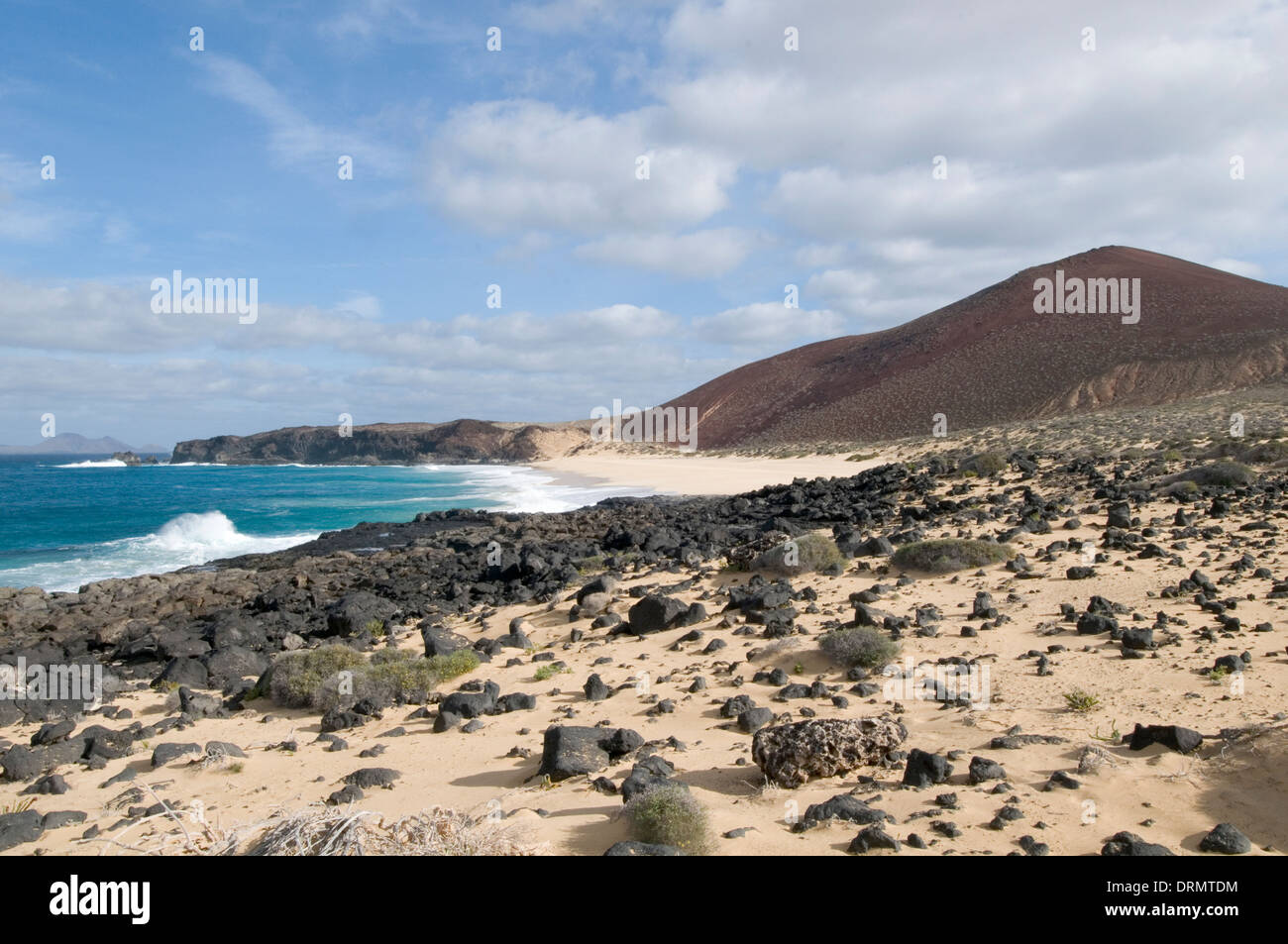 La Gracia Lanzarote Playa de las Conchas Strand Strände zerklüftete Küste Sand sandigen einsamen abgelegenen Ruhe Stockfoto