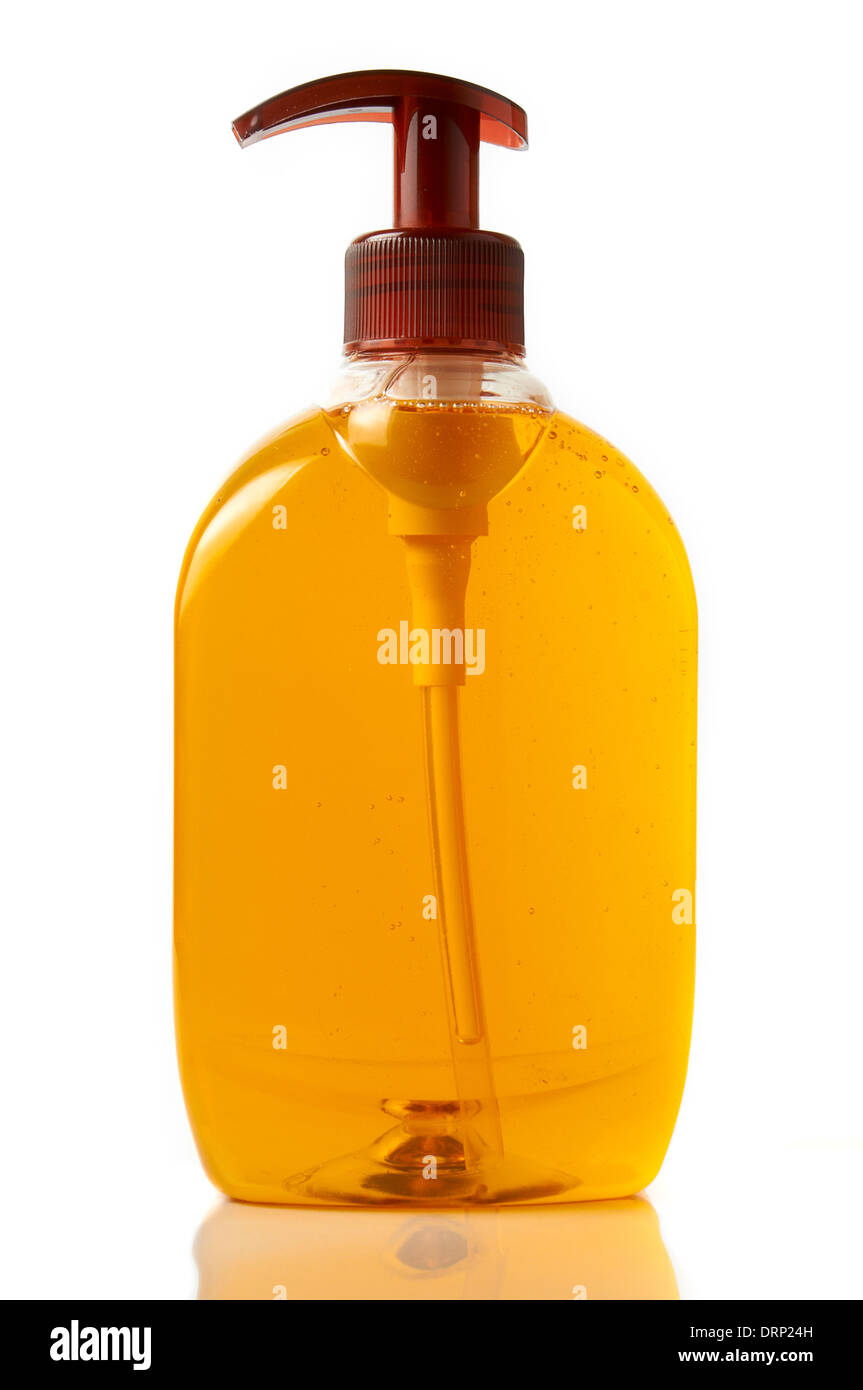 Isolierte volle Flasche orange Flüssigseife für die Hände mit Gegenlicht Stockfoto