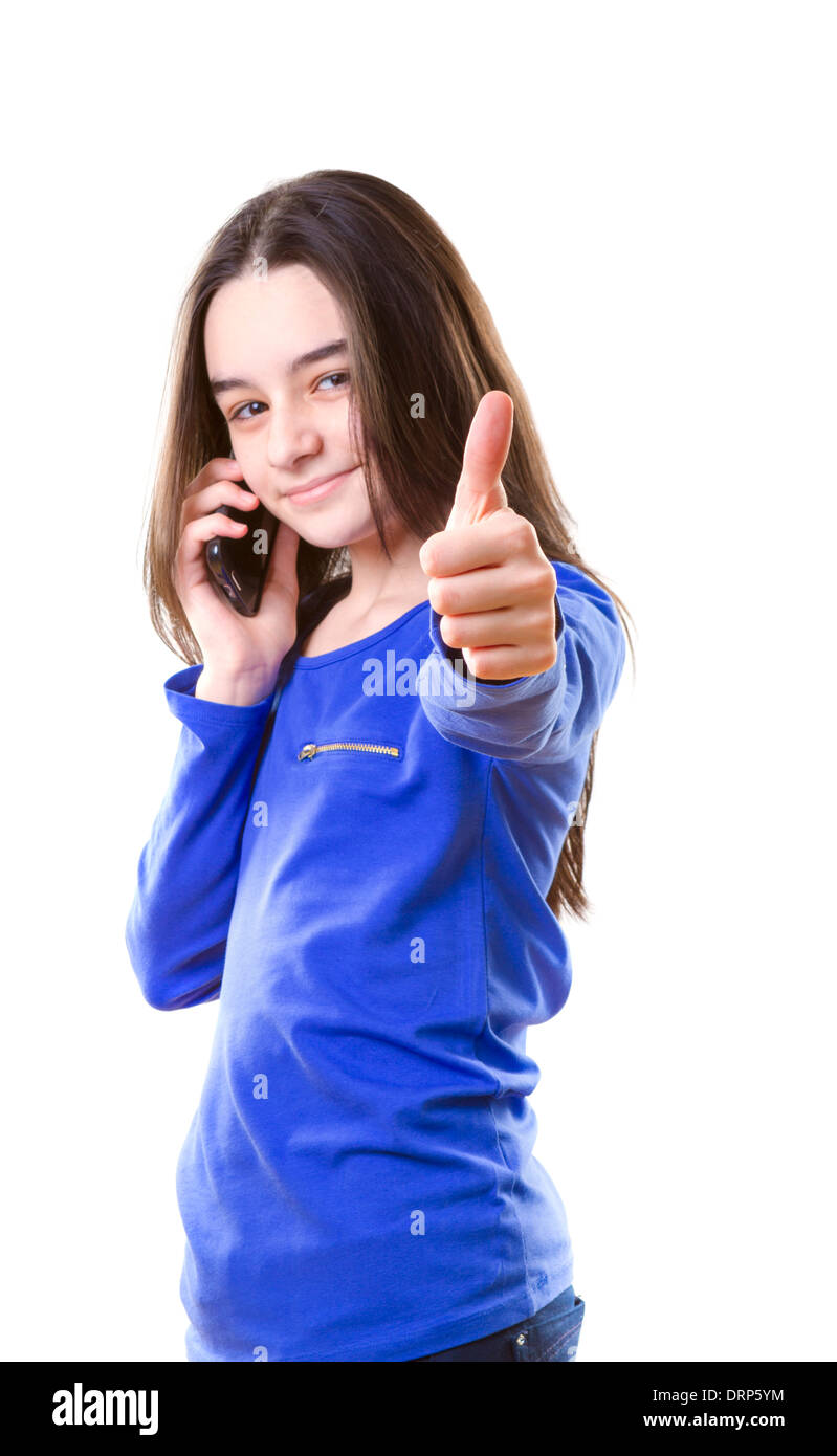 Teenager-Mädchen mit Smartphone deutete mit dem Finger in die Kamera auf weißem Hintergrund Stockfoto