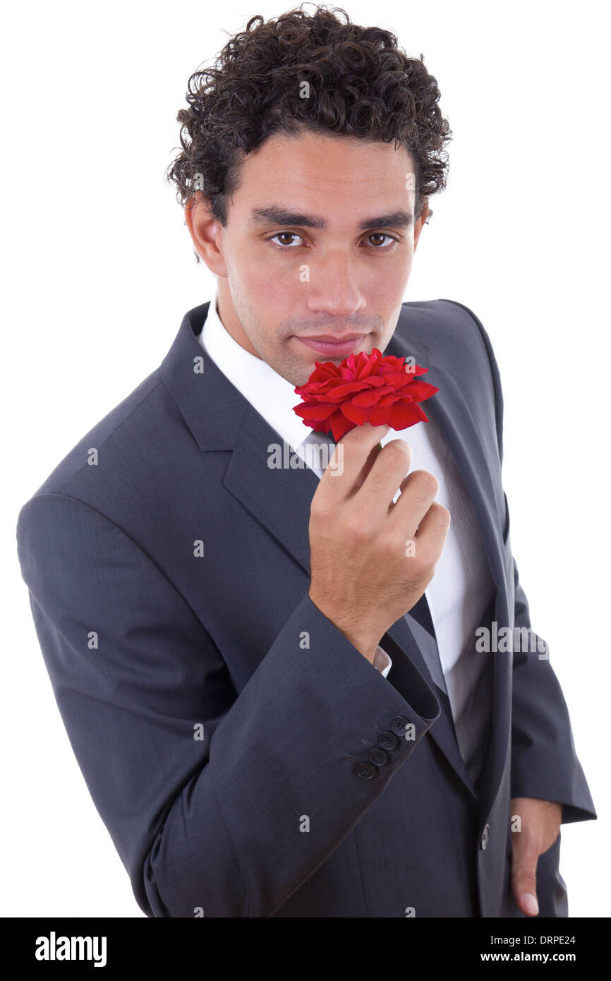gut aussehender Mann in Anzug verführt mit rose Stockfoto