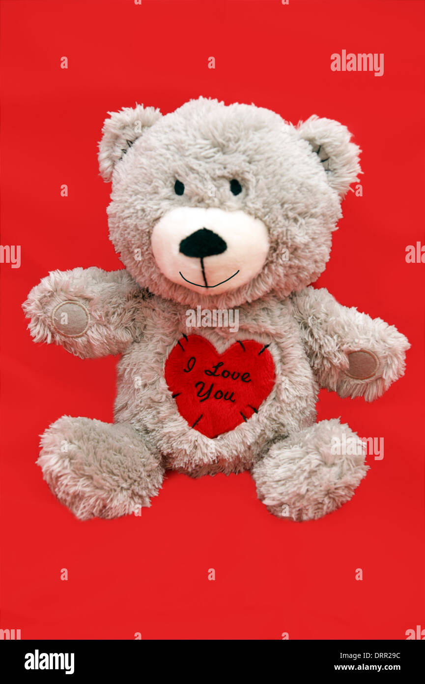 Valentinstag-Teddy-Bär mit Herz 'Ich liebe dich' zu sagen Stockfoto