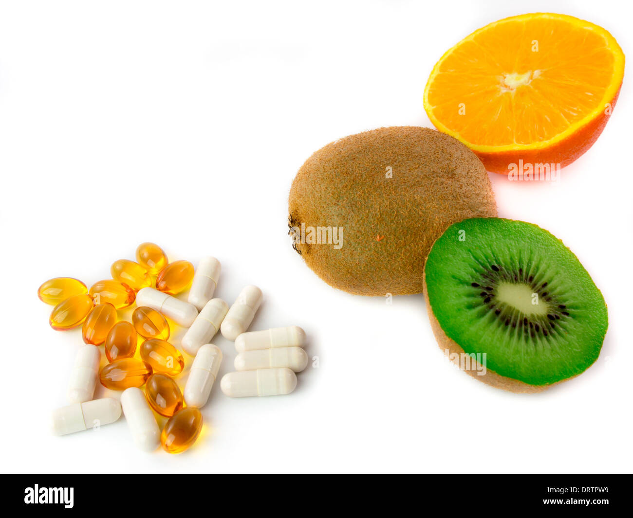 Verschiedene Vitamin-reiche Früchte und Vitamin Tabletten Stockfoto