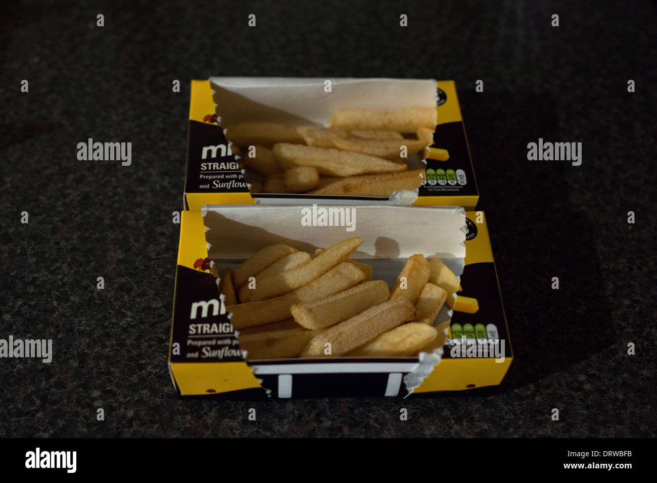 Mikrowelle Kartoffelchips gefrorenen Pommes frites Boxen box Stockfoto