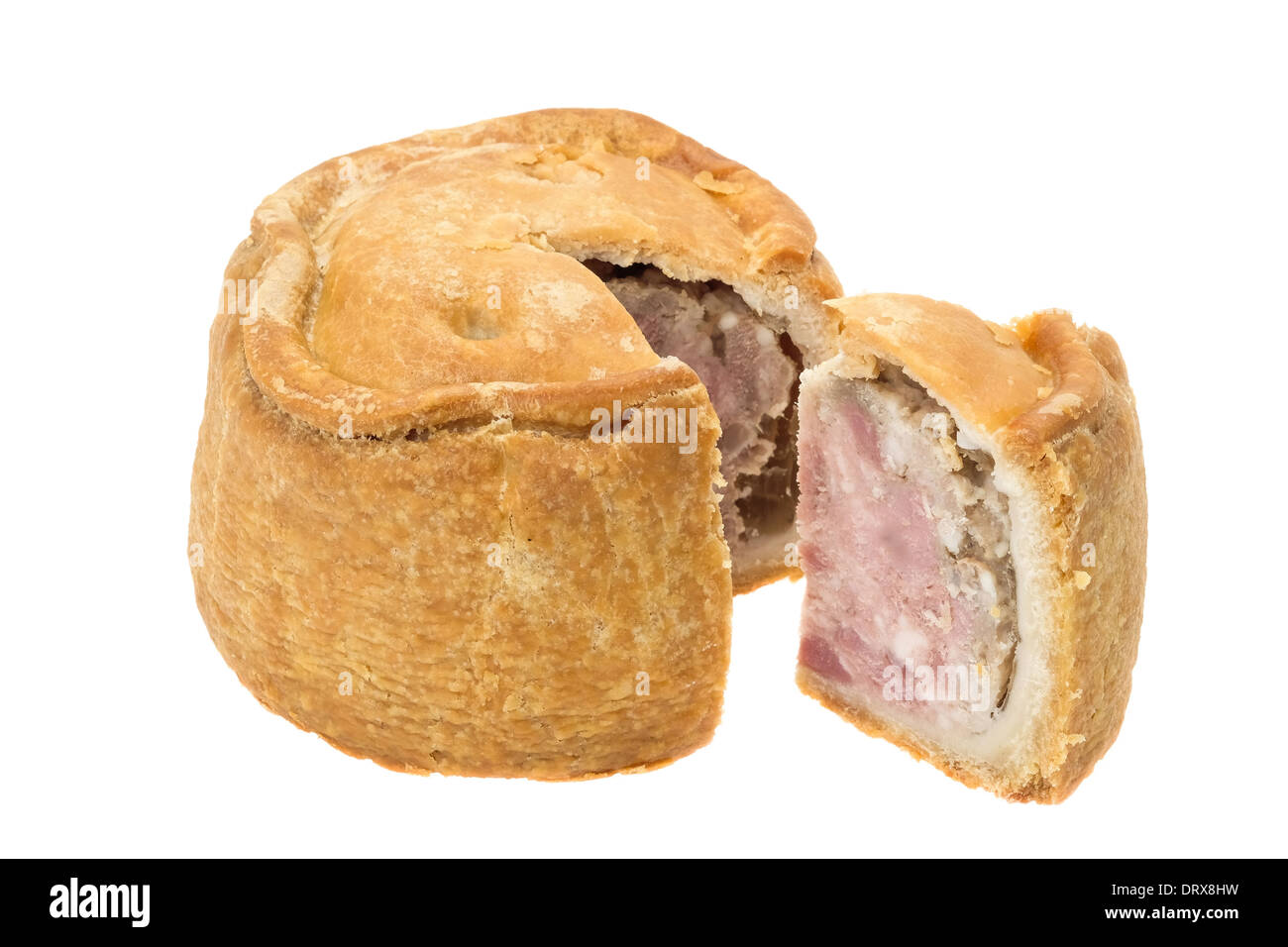 Eine Hand fertig traditionelle Melton Mowbray Pork Pie mit ein Stück Ausschneiden - Studio gedreht mit weißem Hintergrund Stockfoto