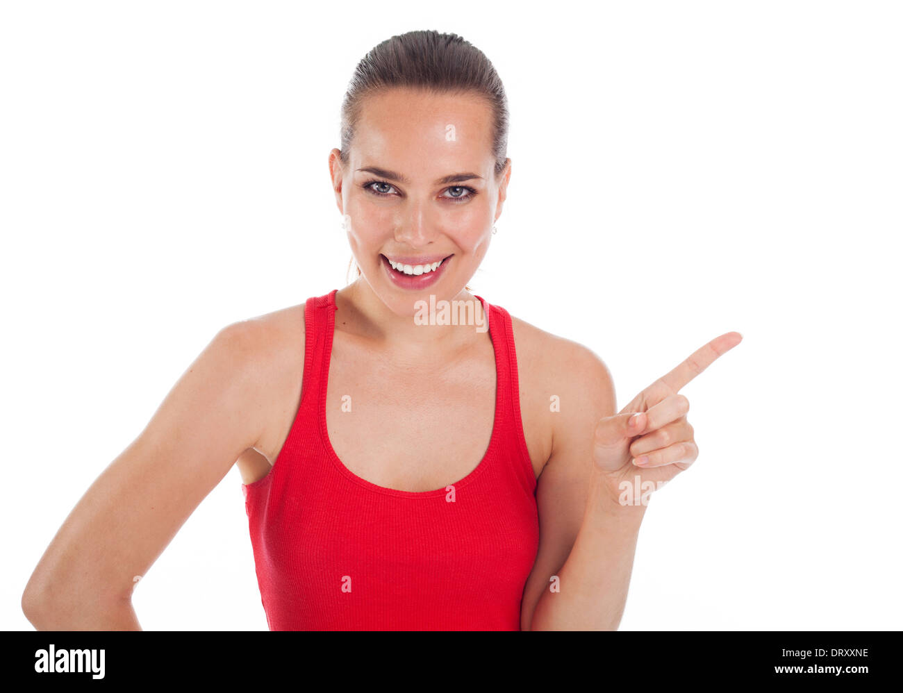 Lächelnde junge Frau, die etwas mit ihrem Finger, Exemplar, isoliert auf weiss Stockfoto