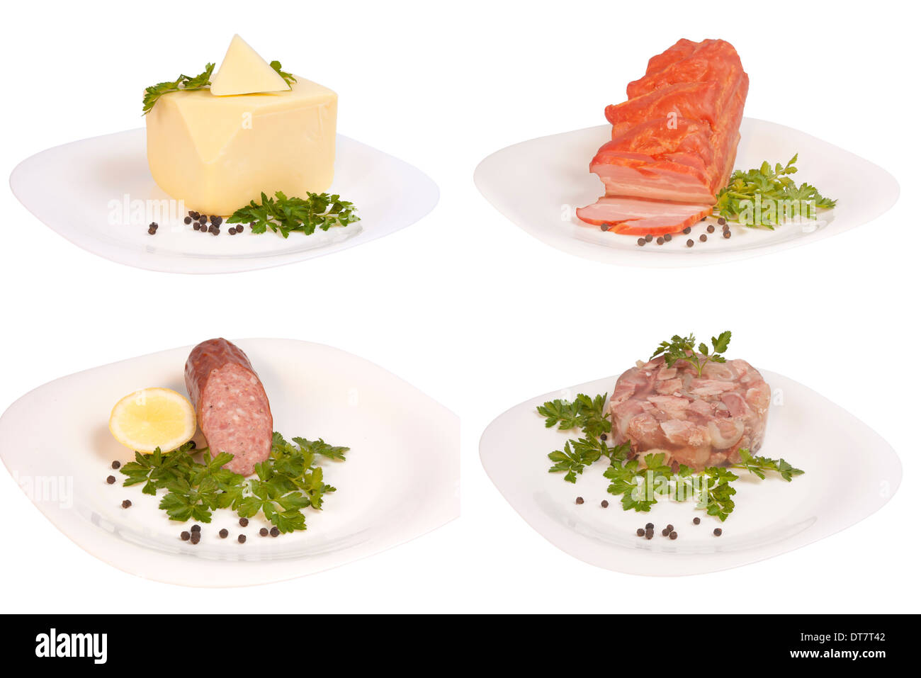 Vier Typen von Speisen mit Petersilie und Pfeffer auf Platte isoliert auf weißem Hintergrund Stockfoto
