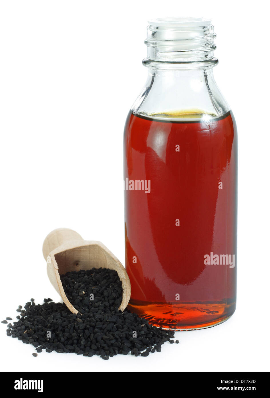 Nigella Sativa (Schwarzkümmel) auf Holzlöffel und ätherisches Öl Stockfoto