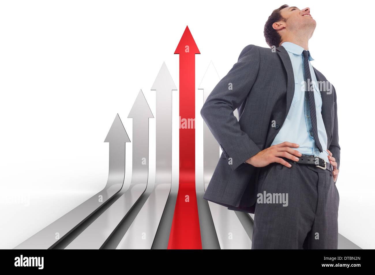 Zusammengesetztes Bild von fröhlich Geschäftsmann mit Händen auf den Hüften Stockfoto