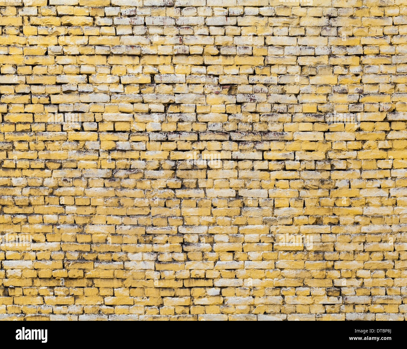 Alte gelbe Ziegel Wand Foto Hintergrundtextur Stockfoto