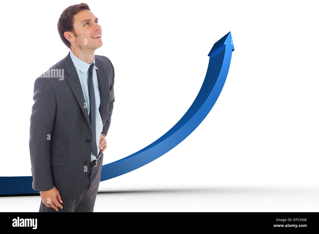 Zusammengesetztes Bild fröhlich Geschäftsmannes stehend mit Hand auf der Hüfte Stockfoto