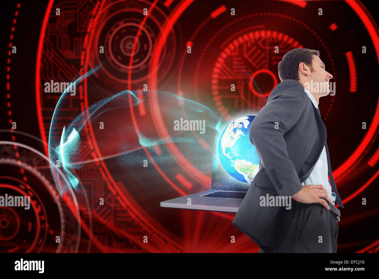 Zusammengesetztes Bild von fröhlich Geschäftsmann stehend mit Händen auf den Hüften Stockfoto