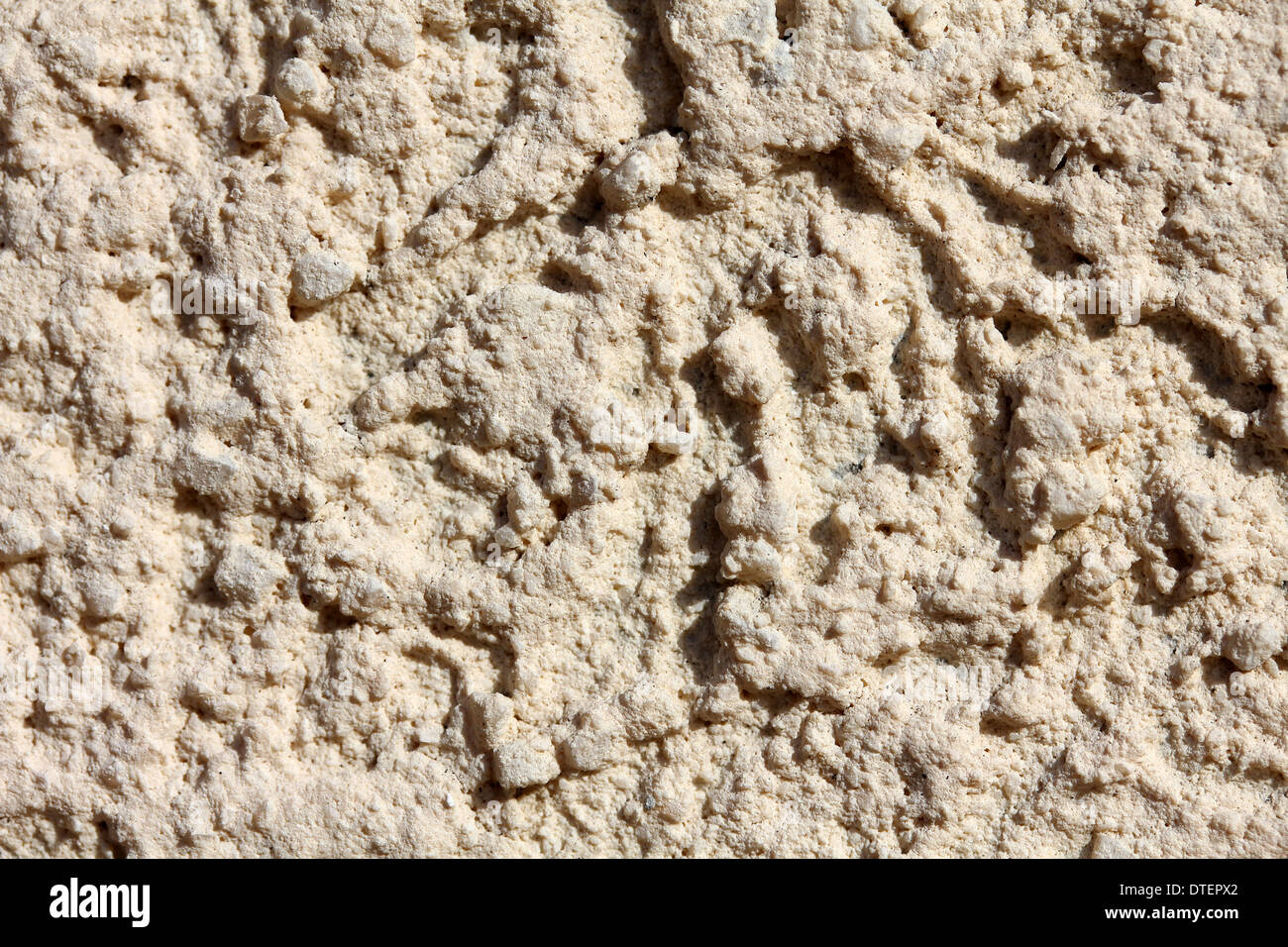 Unebene Oberfläche der Fassade des Hauses als einen schönen Hintergrund. Stockfoto