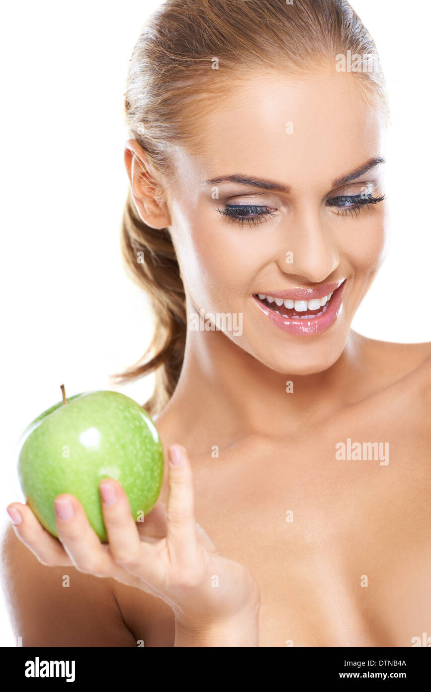 Glückliche Frau mit einem knackigen grünen Apfel Stockfoto