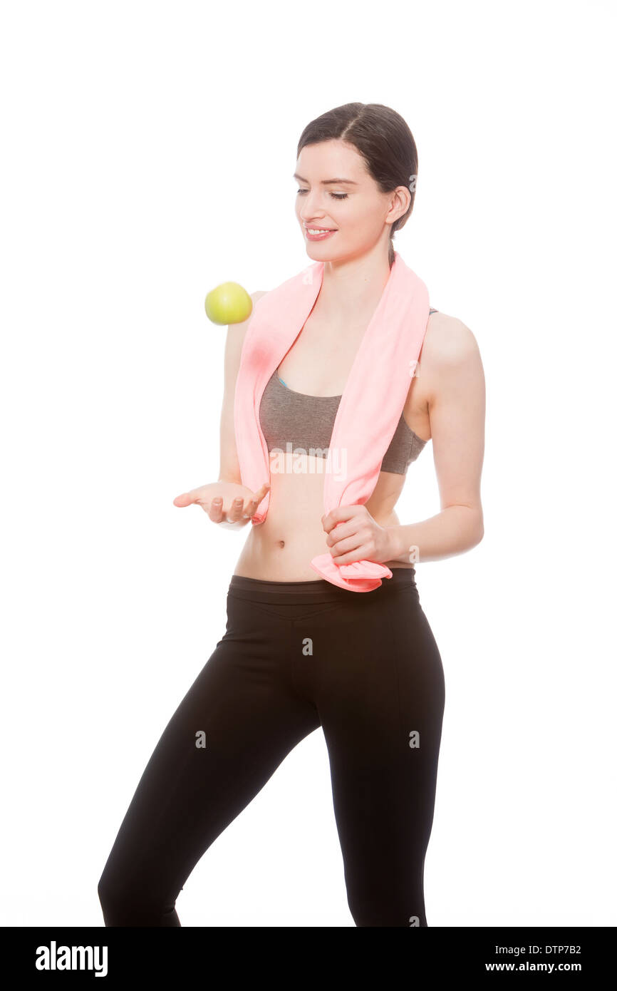 Fitness-Modell mit Apfel Stockfoto