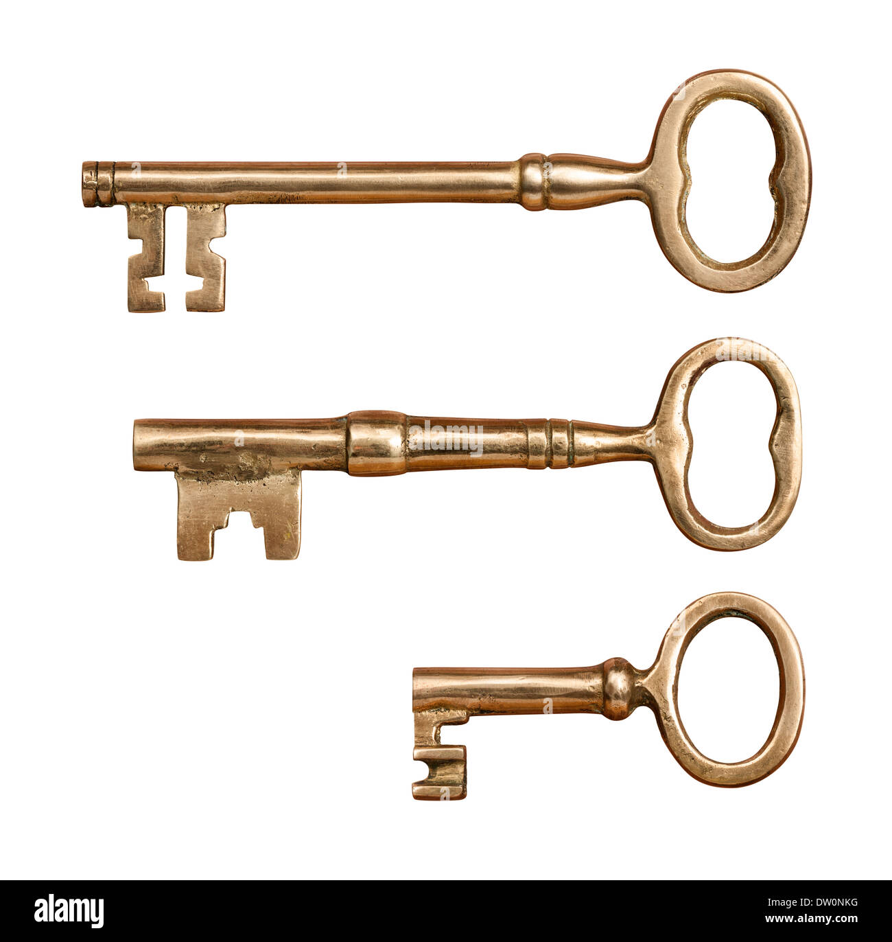 Drei antike Messing Schlüssel isoliert auf weiss. Stockfoto