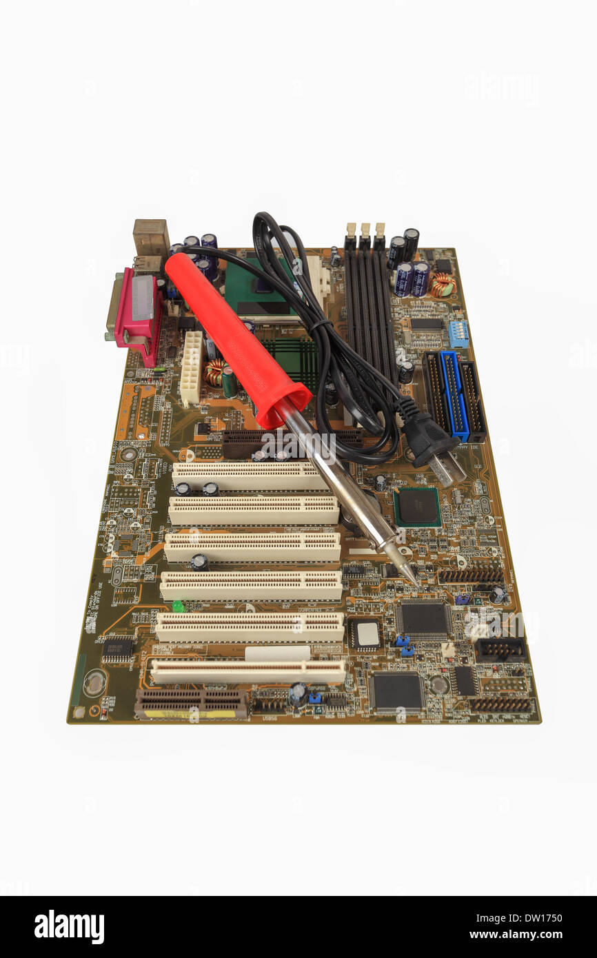 Lötkolben und Computer-motherboard Stockfoto