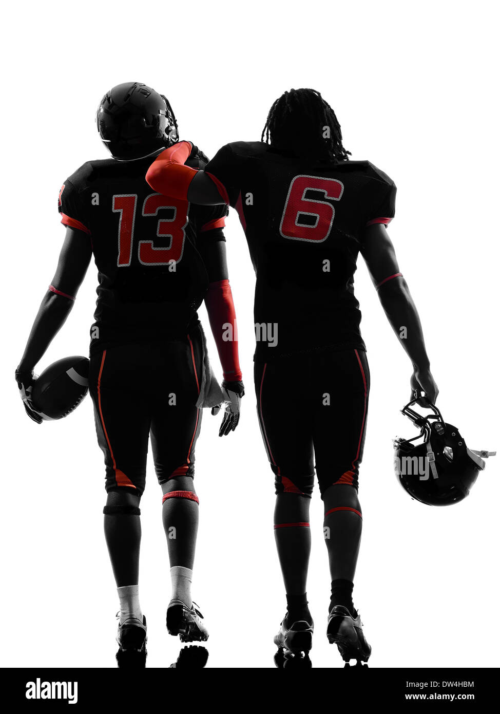 zwei american-Football-Spieler zu Fuß Rückansicht Silhouette Schatten auf weißem Hintergrund Stockfoto