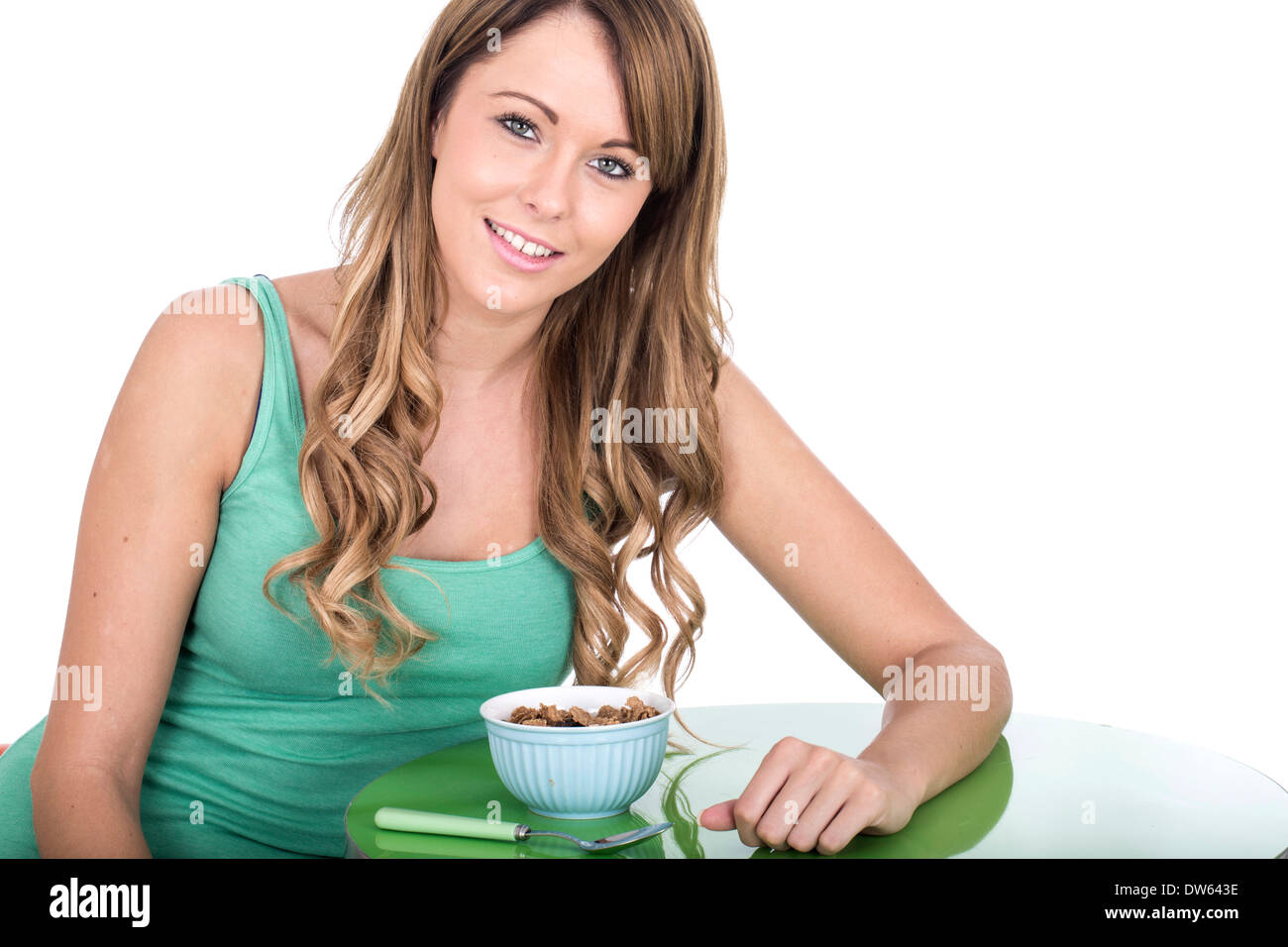 Attraktive junge Frau mit Frühstücks-Cerealien Stockfoto