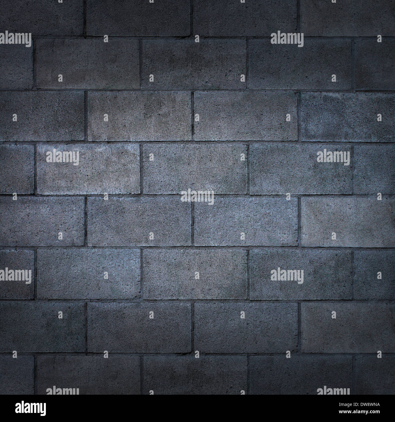 Betonblock Wand oder verwitterten Betonklotz Hintergrund mit einer leeren grobe rustikale Zement Oberflächenstruktur als Kulisse Stockfoto