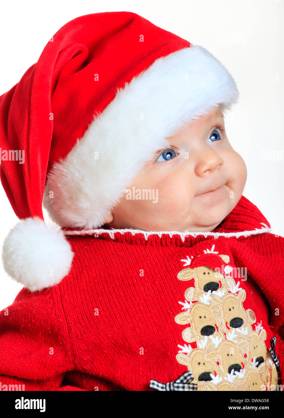Babymädchen trägt einen Weihnachtsmann Anzug und Hut Stockfoto