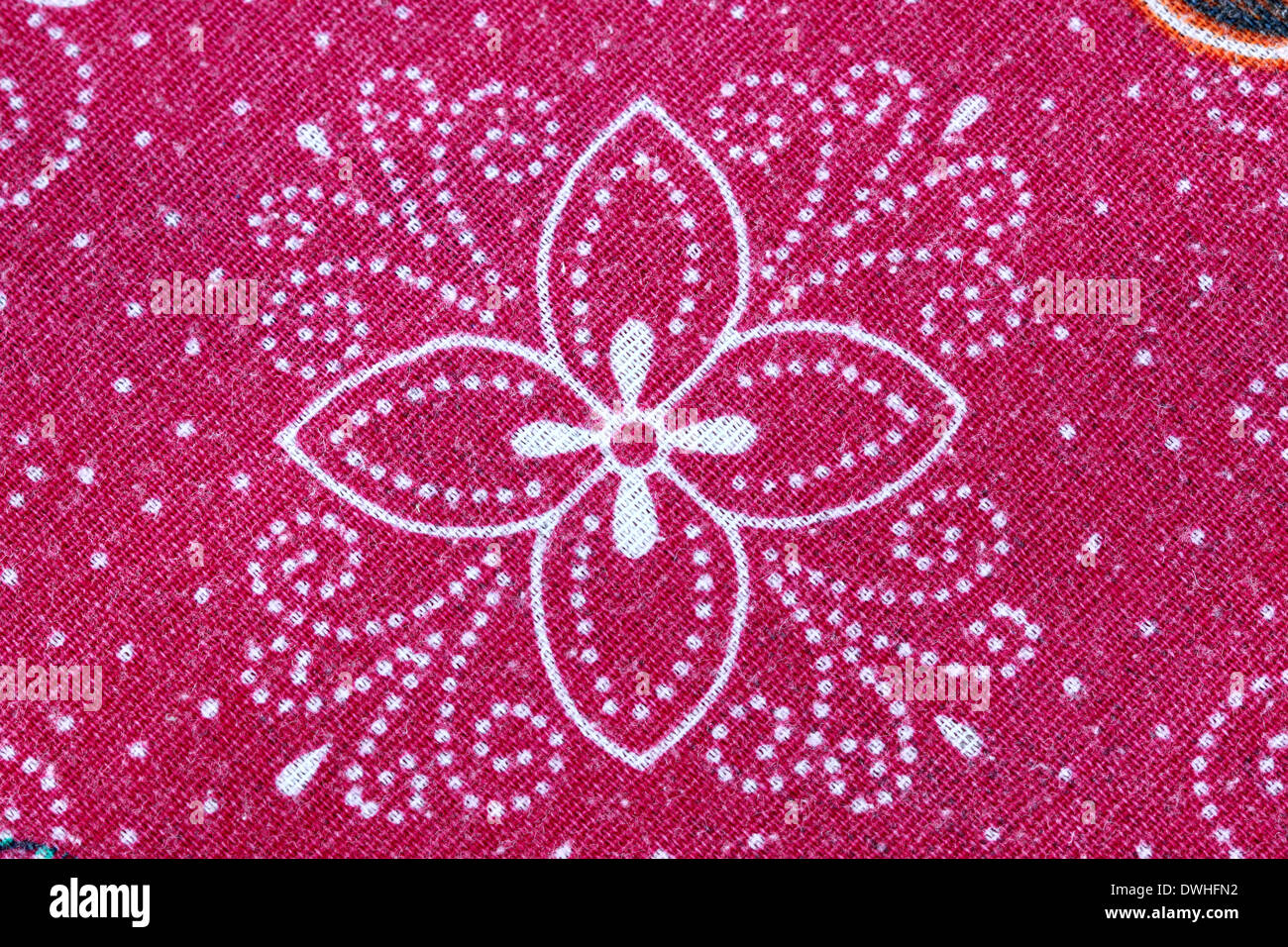 Thai Batik Sarong rote Blume Muster für den Hintergrund. Stockfoto