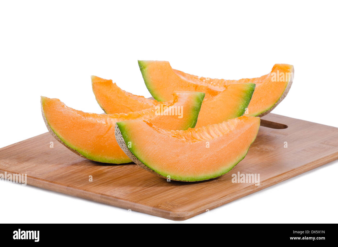 Cantaloupe Melonenscheiben auf Holzbrett Stockfoto