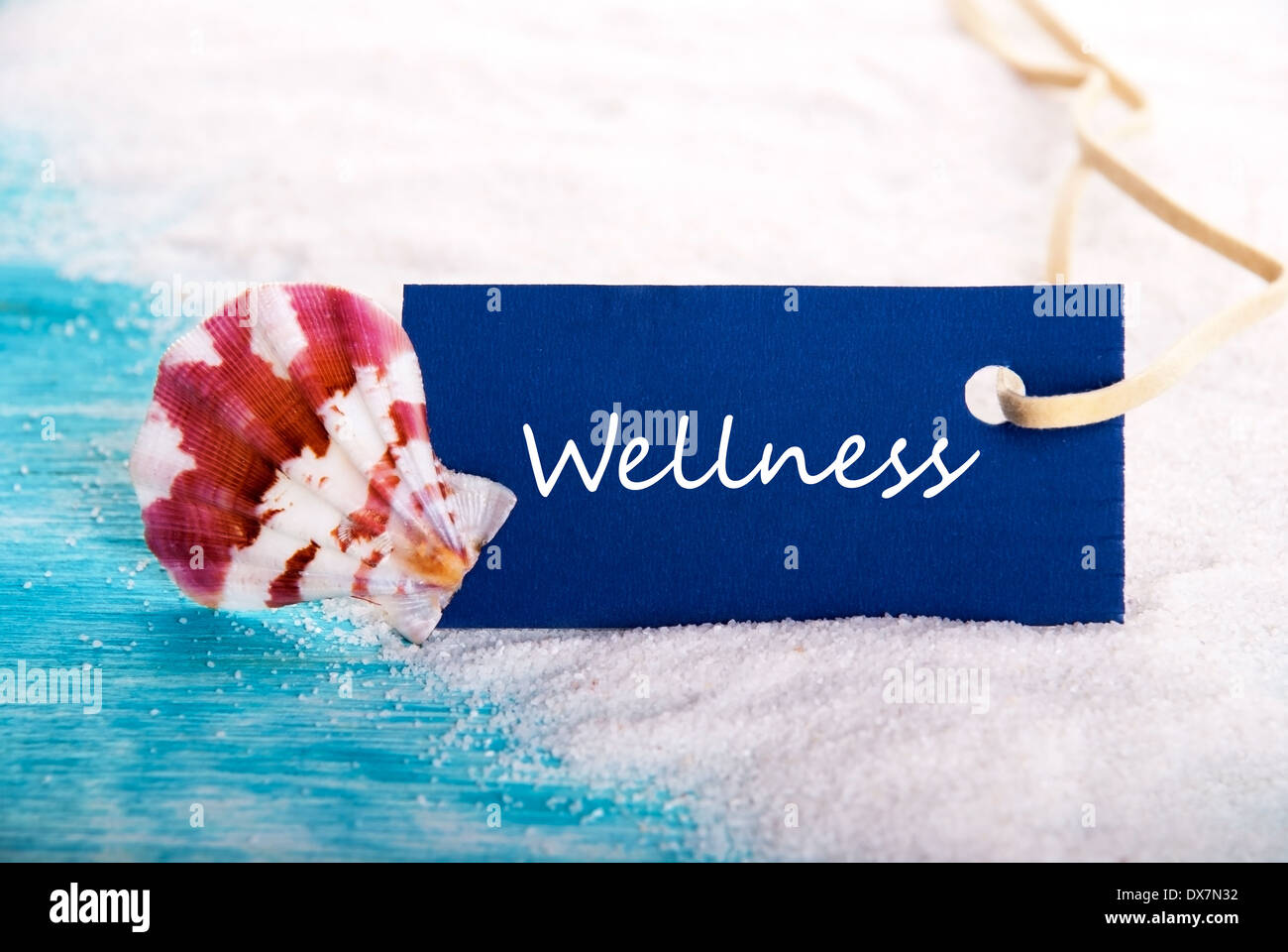Wellness auf einem Etikett am Strand Stockfoto