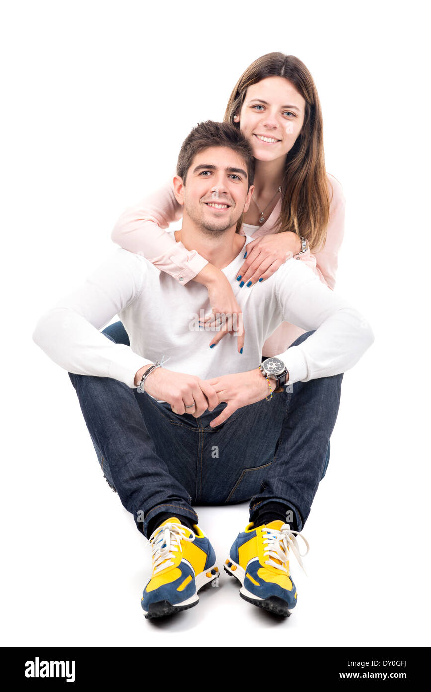 Glückliches junges Paar isoliert in weiß Stockfoto