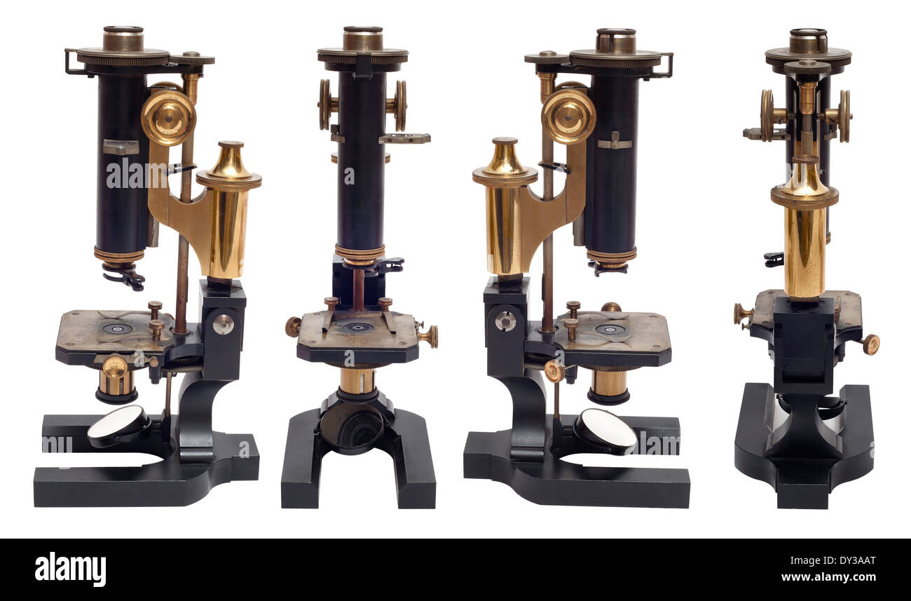 Vier Ansichten von einem frühen Messing antik petrologischen Mikroskop von R. Fuess Berlin, Deutschland, Cut-out-weißer Hintergrund Stockfoto