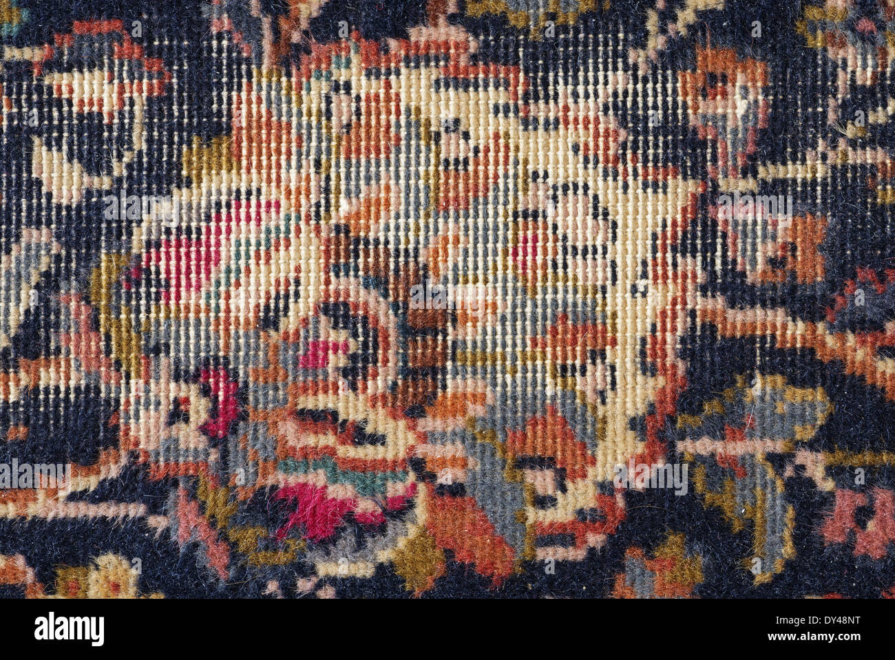 abgetragenen alten persischen Teppich Hintergrund detail Stockfoto