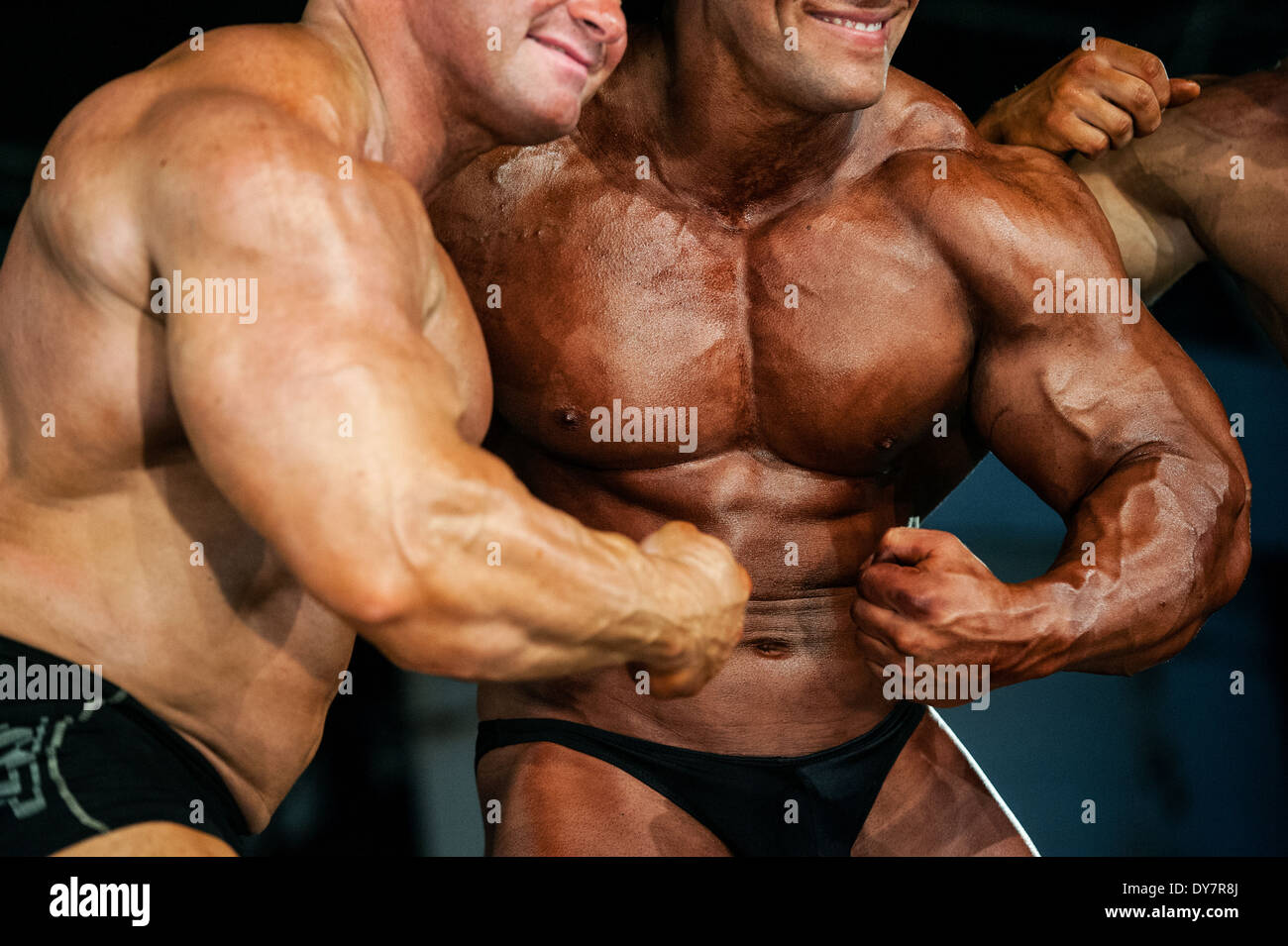Detail von einem männlichen Bodybuilder während der Fitness-Messe FIBO in Köln, 2014. Stockfoto