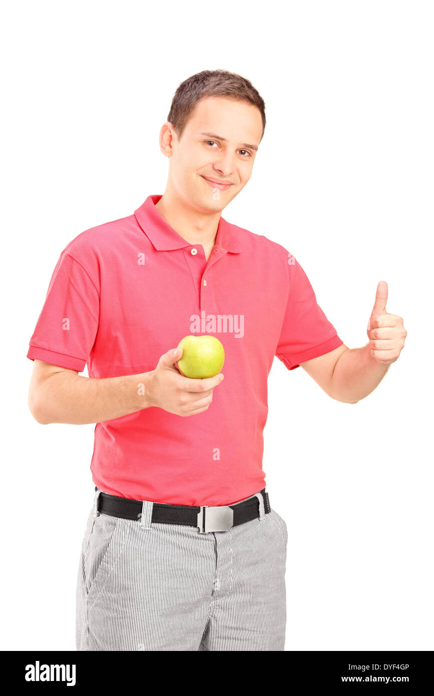 Mann hält einen Apfel und Daumen aufgeben Stockfoto