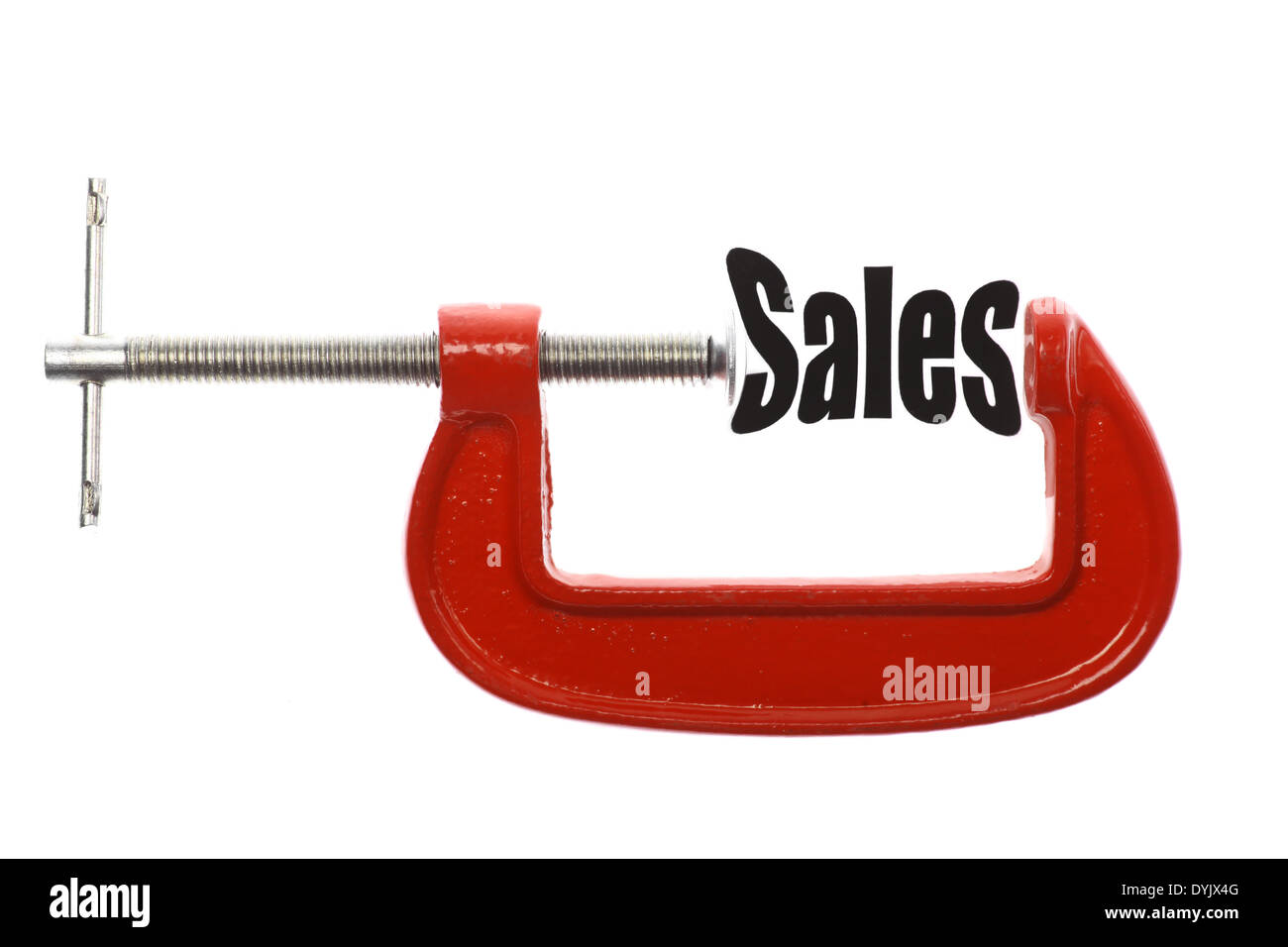 Das Wort "Umsatz" ist mit einem Schraubstock komprimiert. Business-Metapher. Stockfoto