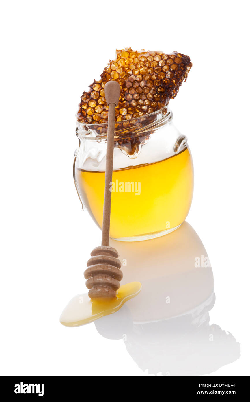 Bio Bienenhonig in Glas mit Löffel und Biene Kamm aus Holz Honig. Luxuriöse Biene Hintergrund. Stockfoto