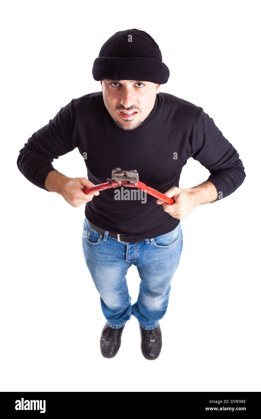 ein Einbrecher oder ein Dieb hält große Drahtschneider Stockfoto