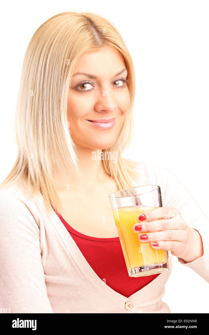 Blonde Frau trinkt Orangensaft Stockfoto