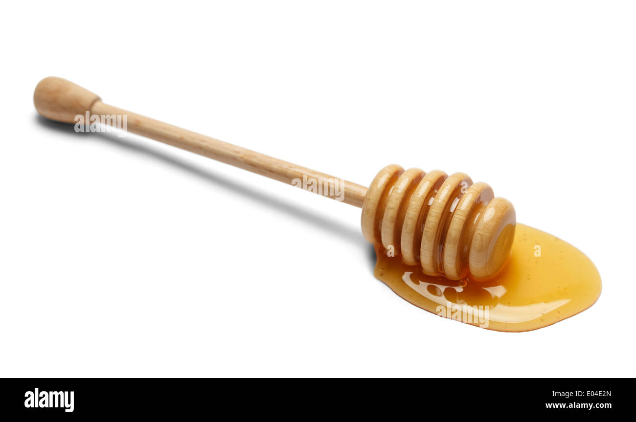 Rühren Sie Holz Stick mit Honig, Isolated on White Background. Stockfoto
