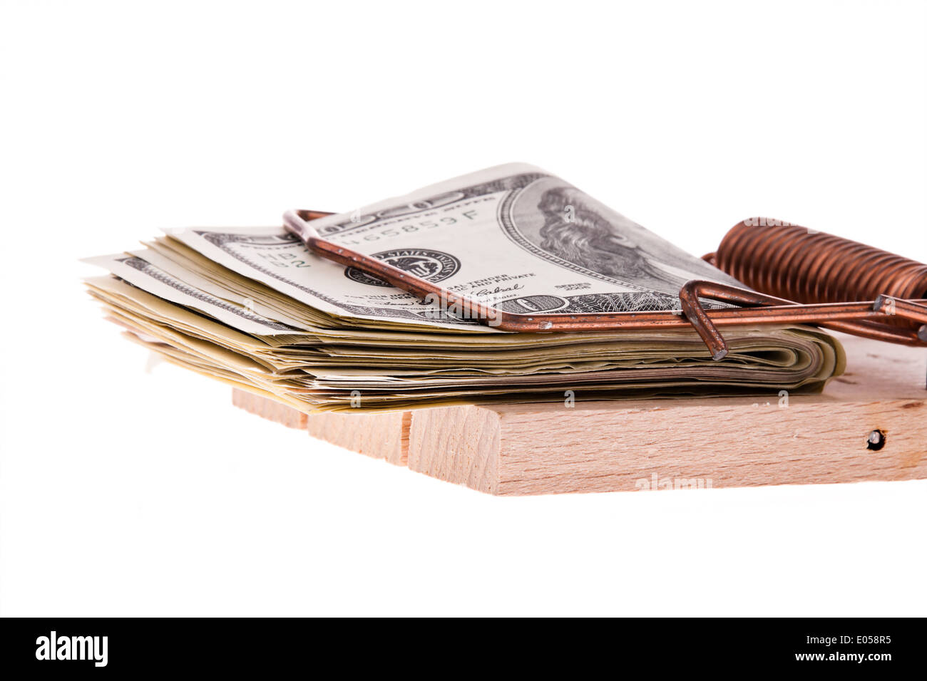 Eine Menge Dollar von Banknoten in einer Mausefalle. Schulden und Budget, Viele Dollar Geldscheine in Einer Mausefalle. Schulden Und Budge Stockfoto