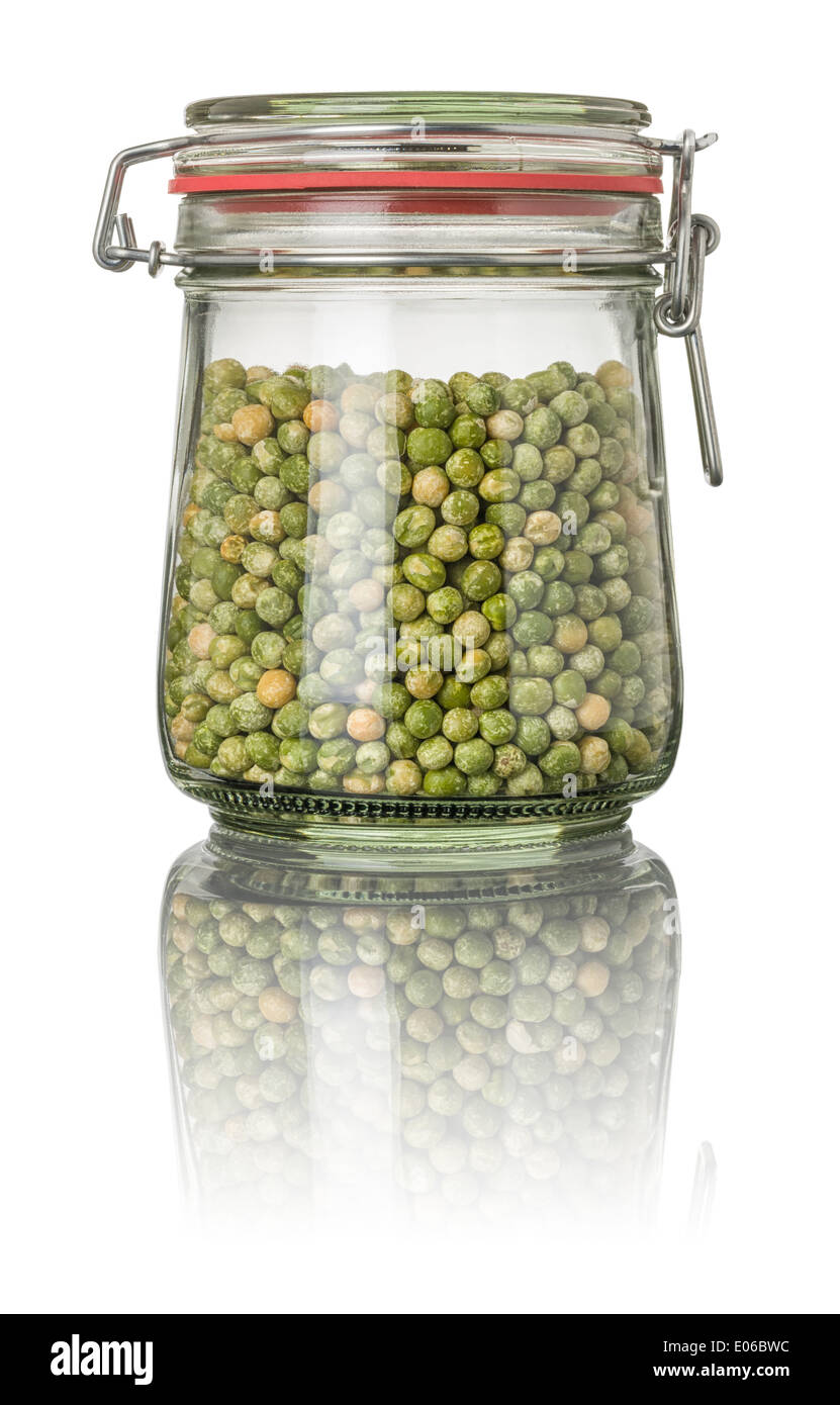 Grüne Erbsen im Glas Stockfotografie