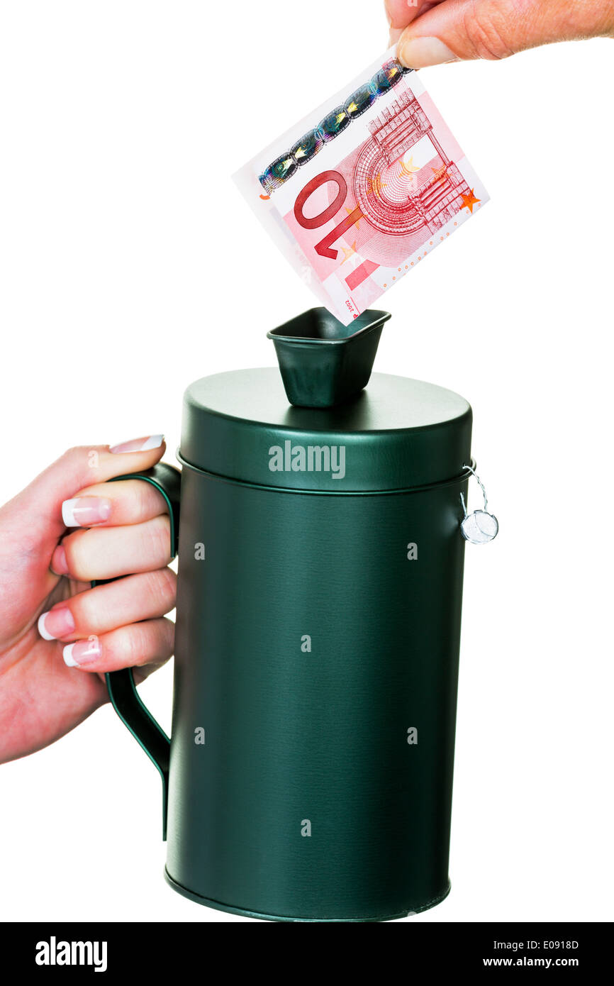 Eine Hand hält ein Spendensose. Geld wird gesammelt., Eine Hand Haelt Eine Spendensose. Es Wird Geld Gesammelt. Stockfoto