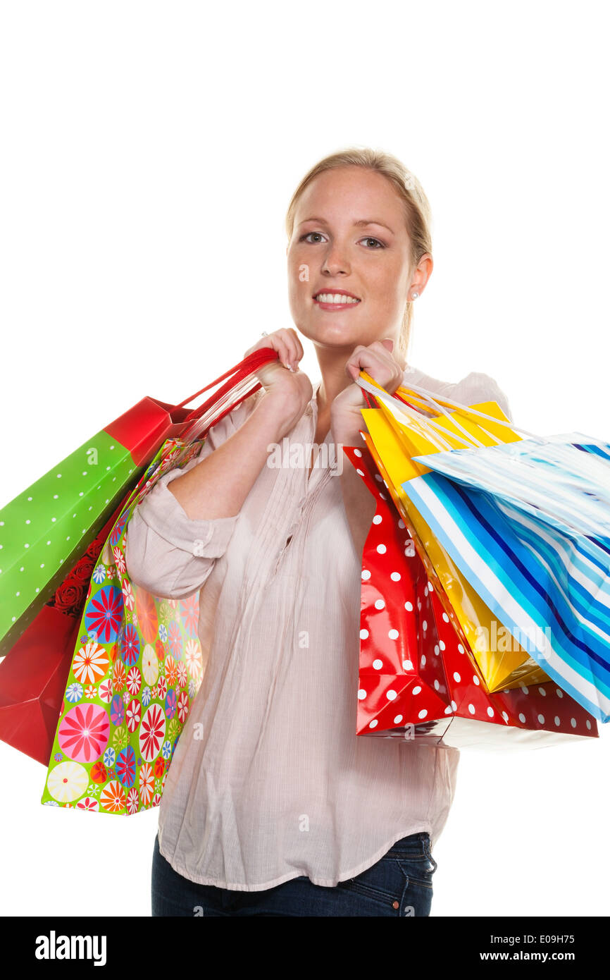 Eine junge Frau mit farbigen Tragetaschen beim Einkaufen. Freut sich über das Schnäppchen., Eine Junge Frau Mit Bunton Einkaufstasc Stockfoto